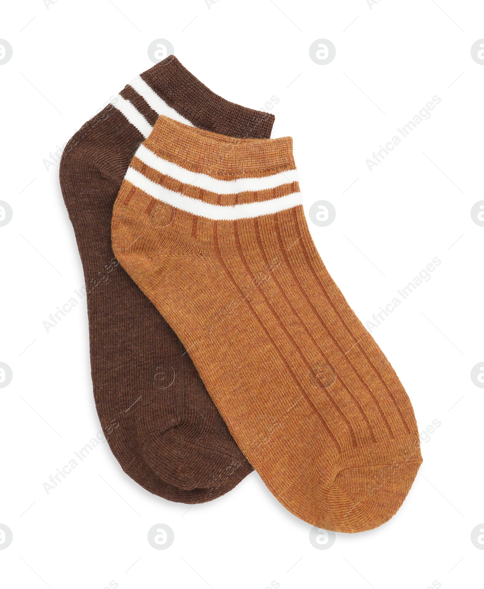 Photo of Pairs of soft socks isolated on white, top view