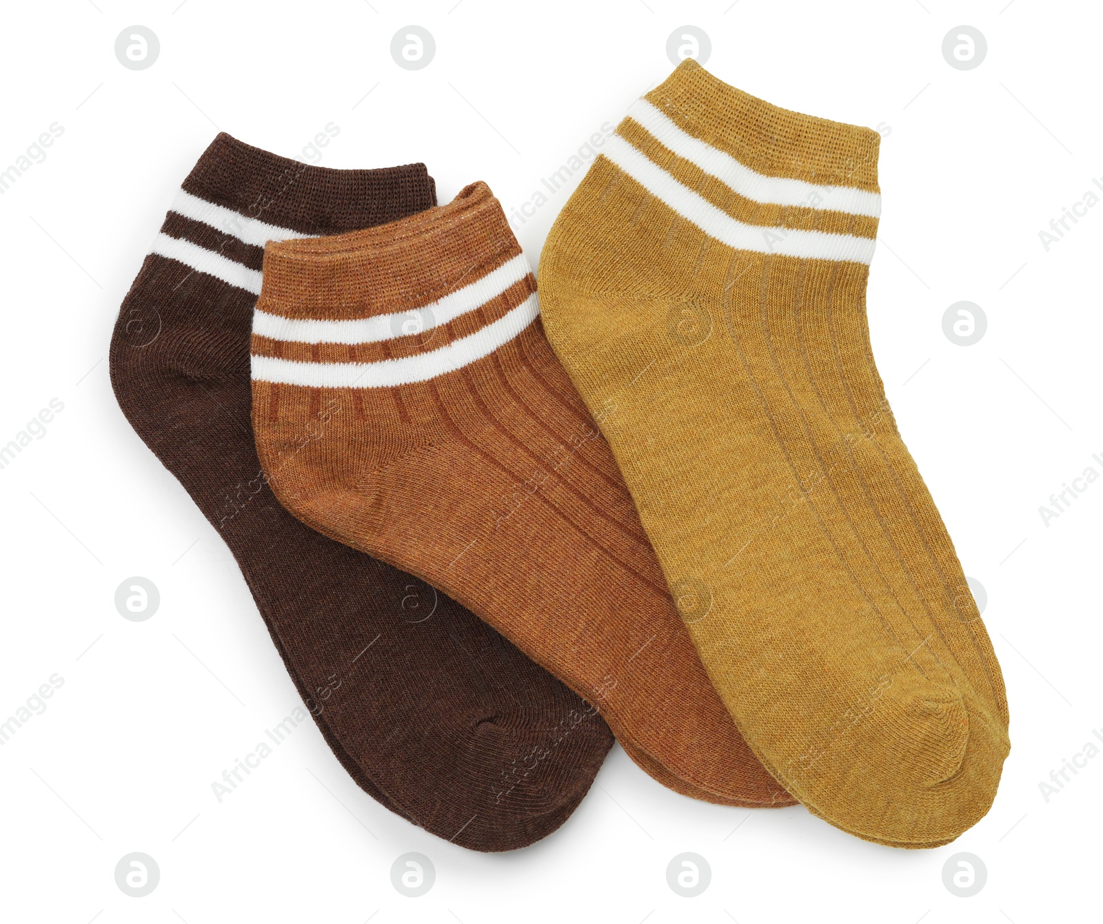 Photo of Pairs of soft socks isolated on white, top view