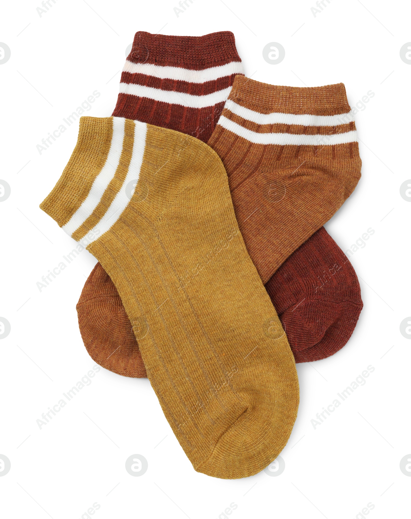 Photo of Pairs of soft socks isolated on white, top view