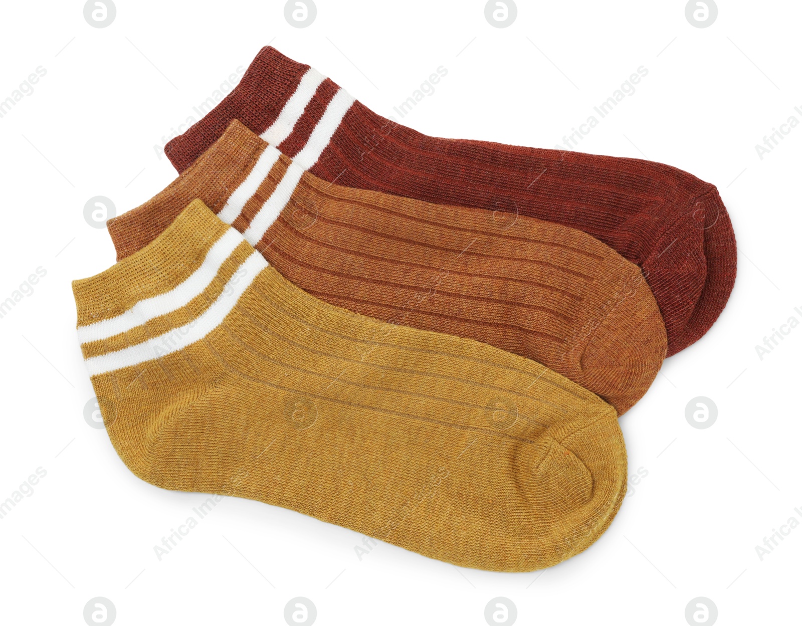 Photo of Pairs of soft socks isolated on white, top view