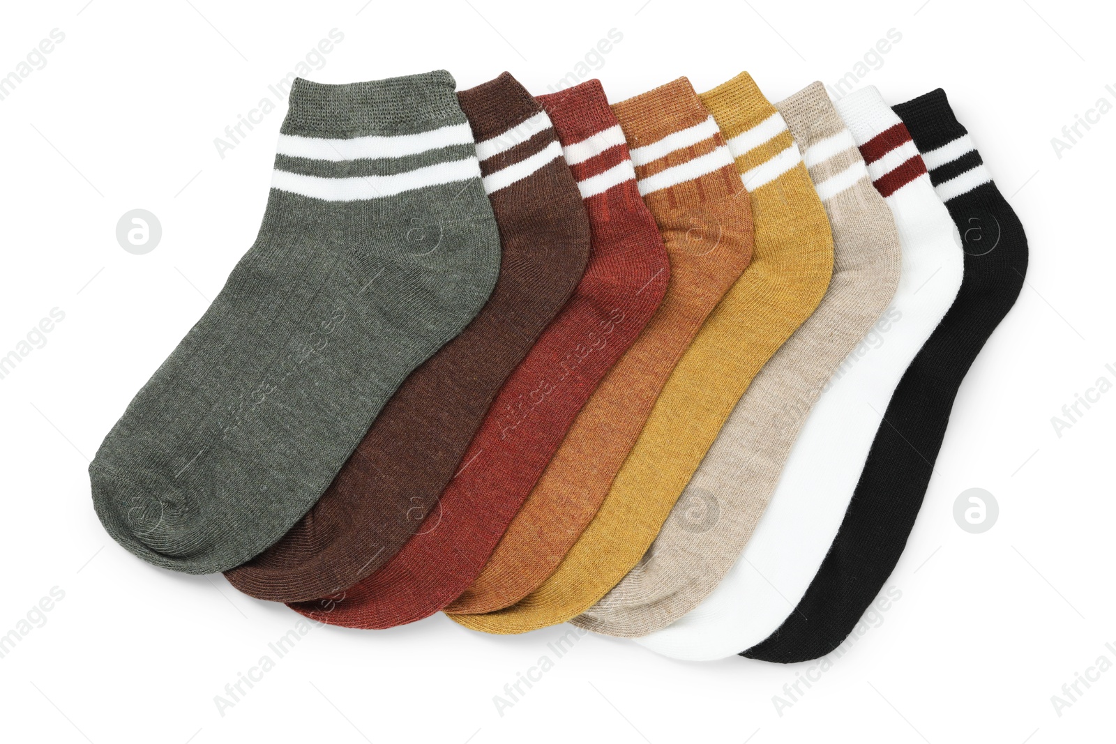 Photo of Pairs of soft socks isolated on white, top view