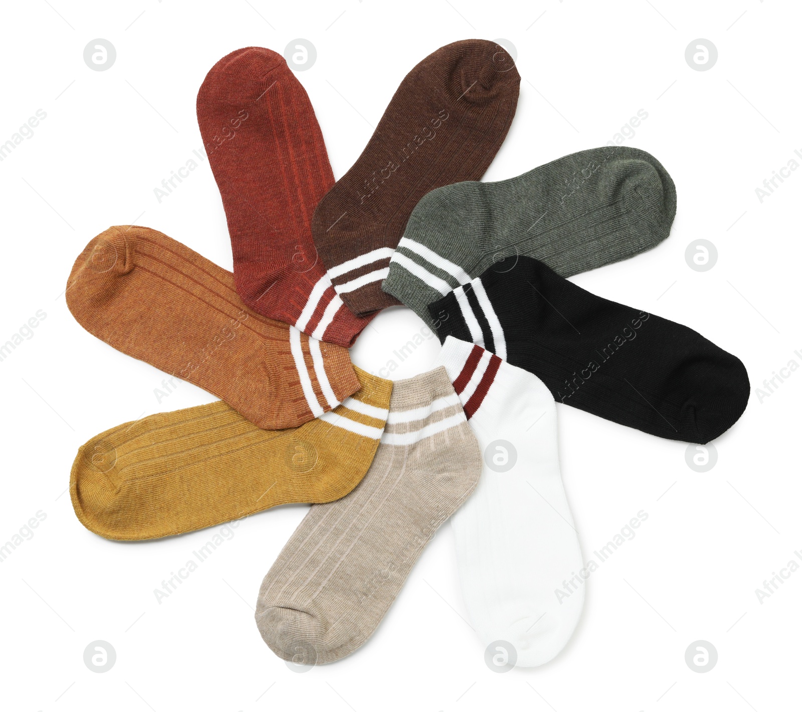 Photo of Pairs of soft socks isolated on white, top view