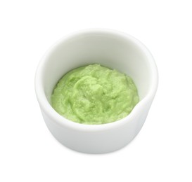 Photo of Hot wasabi paste in bowl isolated on white