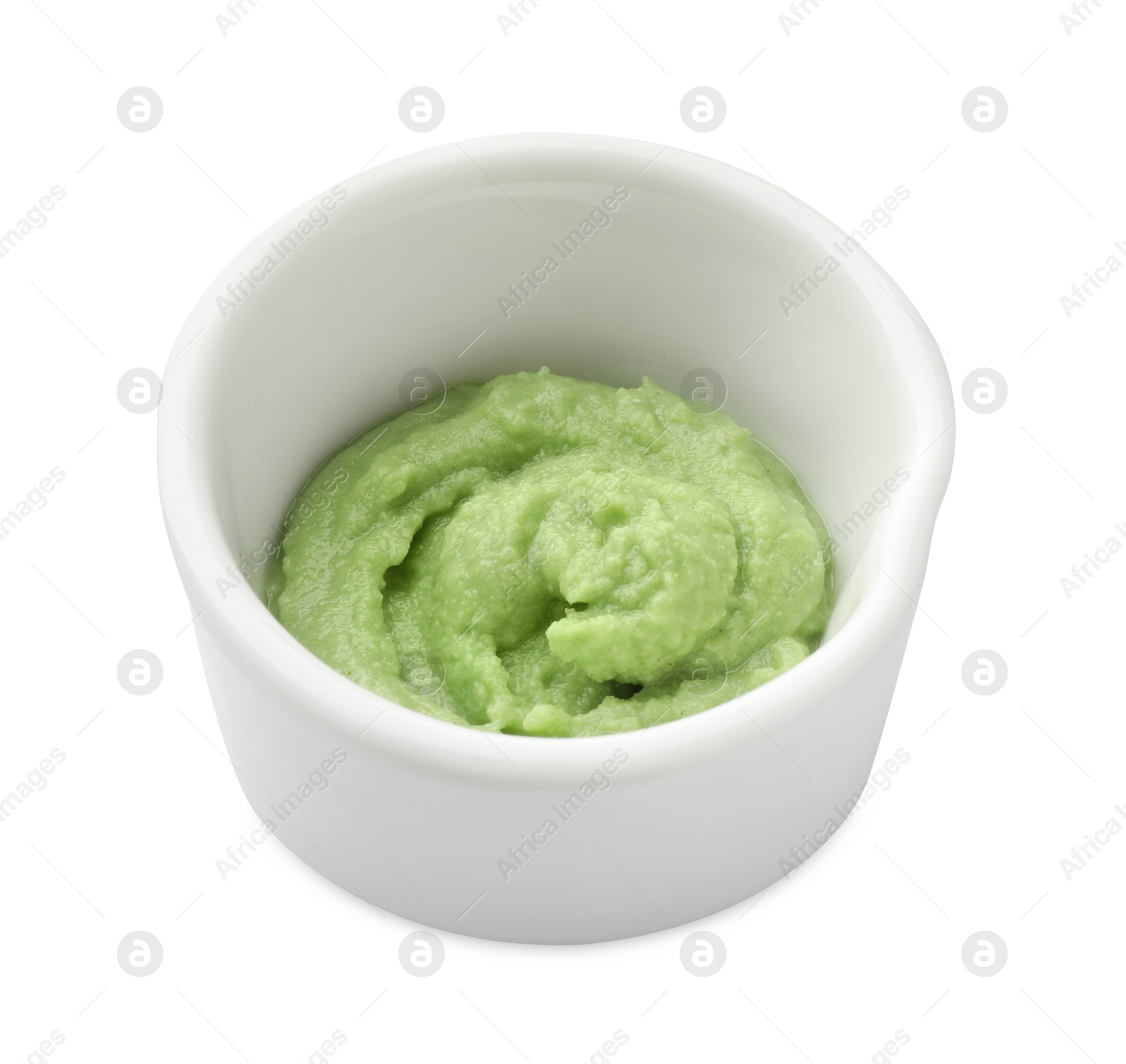 Photo of Hot wasabi paste in bowl isolated on white