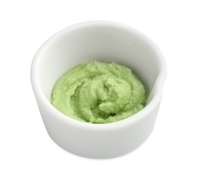 Photo of Hot wasabi paste in bowl isolated on white