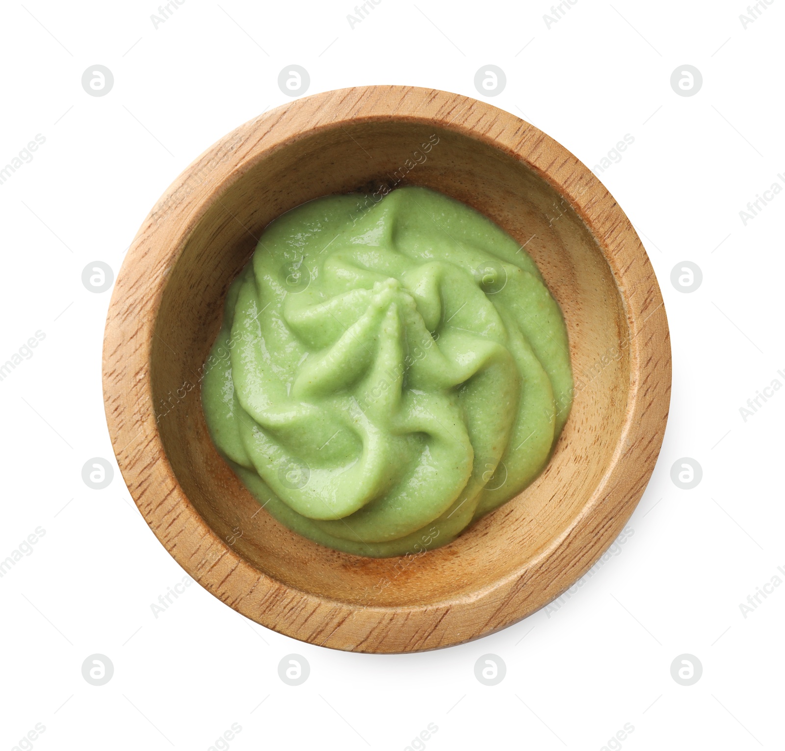 Photo of Hot wasabi paste in bowl isolated on white, top view