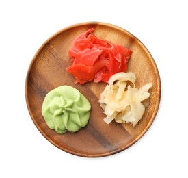 Photo of Hot wasabi paste and ginger isolated on white, top view