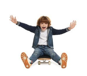 Photo of Emotional little boy on skateboard against white background