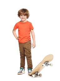 Photo of Little boy with skateboard on white background