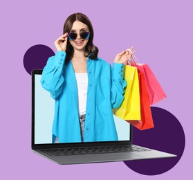 Internet shopping. Happy woman with shopping bags coming out of laptop on color background