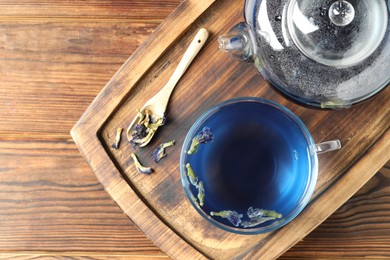 Photo of Delicious butterfly pea flower tea on wooden table