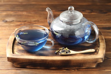 Photo of Delicious butterfly pea flower tea on wooden table