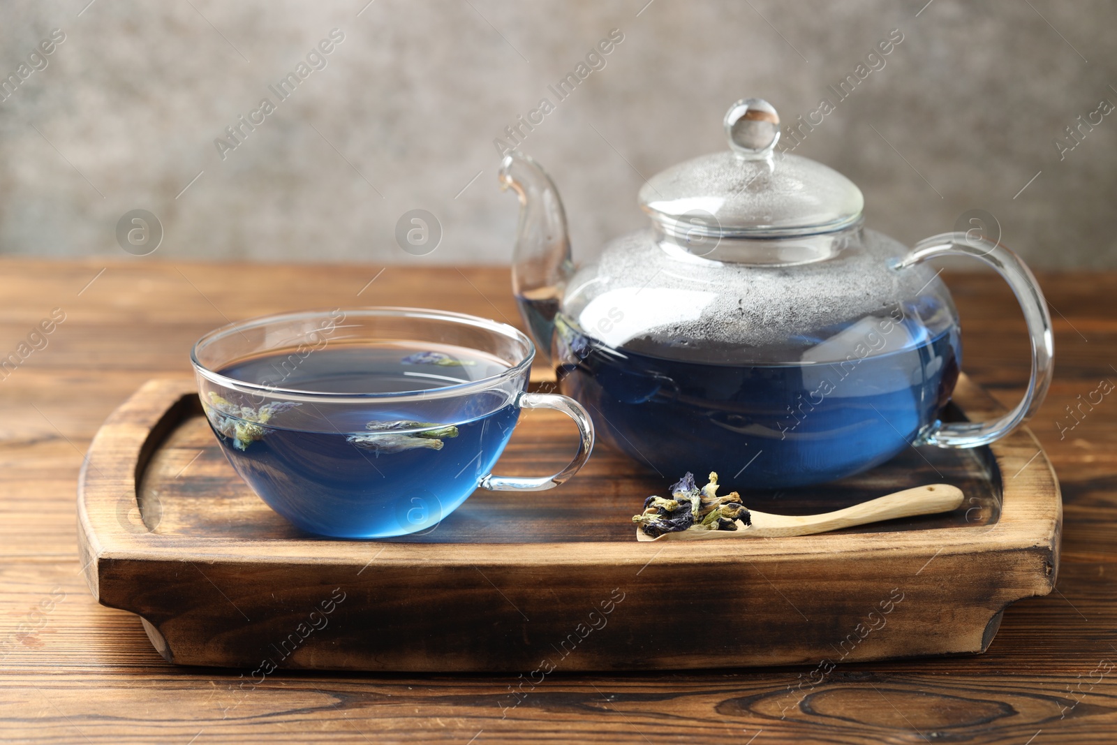 Photo of Delicious butterfly pea flower tea on wooden table