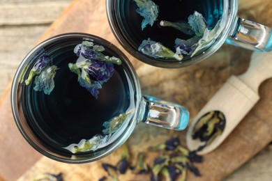 Photo of Delicious butterfly pea flower tea on table, flat lay