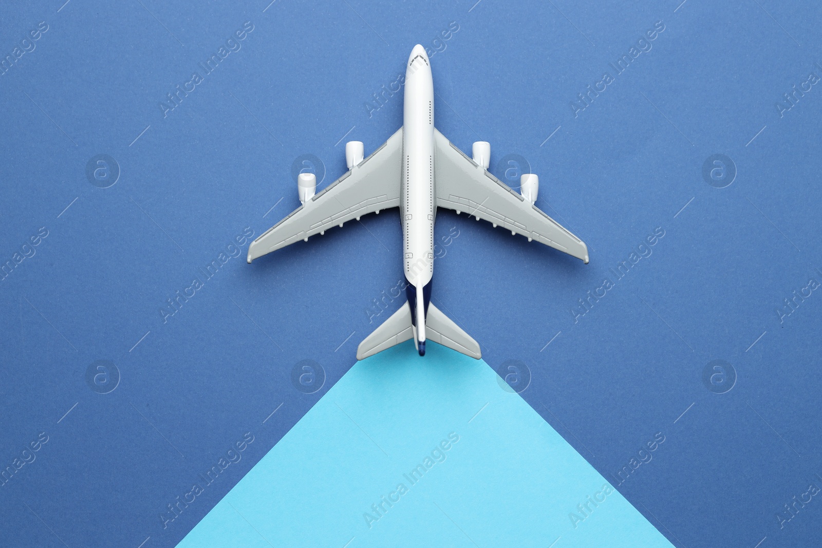 Photo of Plane model on color background, top view