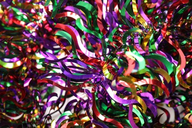 Photo of Many colorful tinsels as background, closeup view