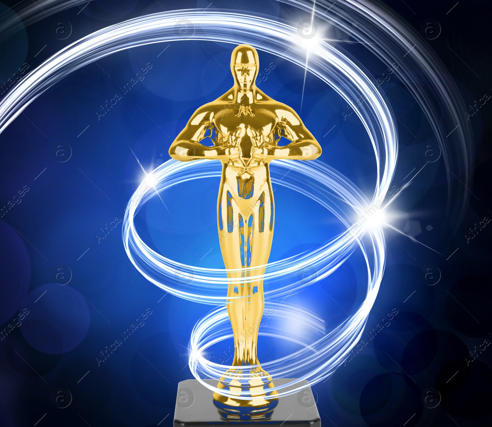 Image of Golden trophy in shape of human figure on blue gradient background. Light trace around statuette