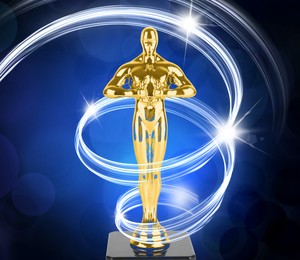 Image of Golden trophy in shape of human figure on blue gradient background. Light trace around statuette