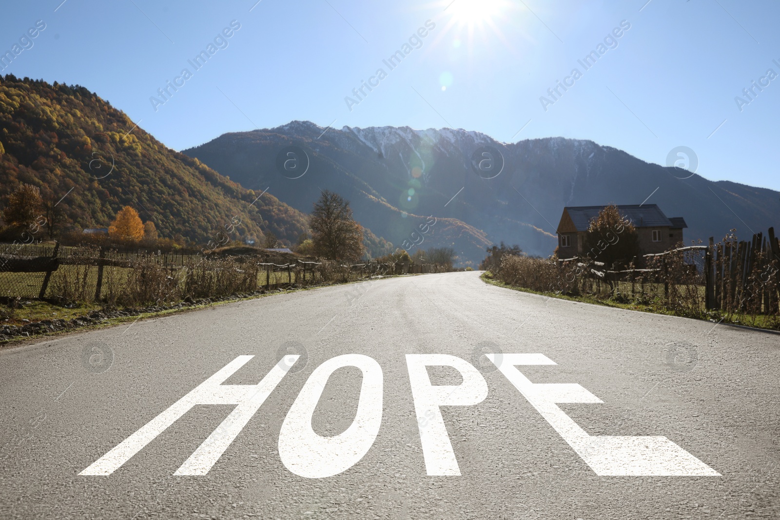 Image of Word Hope on asphalt road leading to mountain