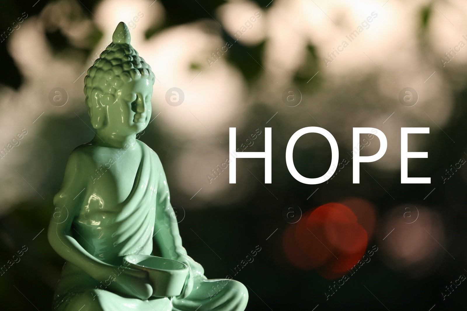 Image of Hope. Decorative Buddha statue on blurred background