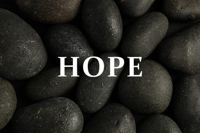 Image of Hope. Wet stones as background, top view