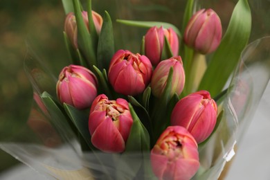 Photo of Beautiful bouquet of tulip flowers outdoors, closeup