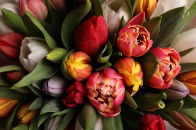 Photo of Beautiful bouquet of colorful tulip flowers, closeup