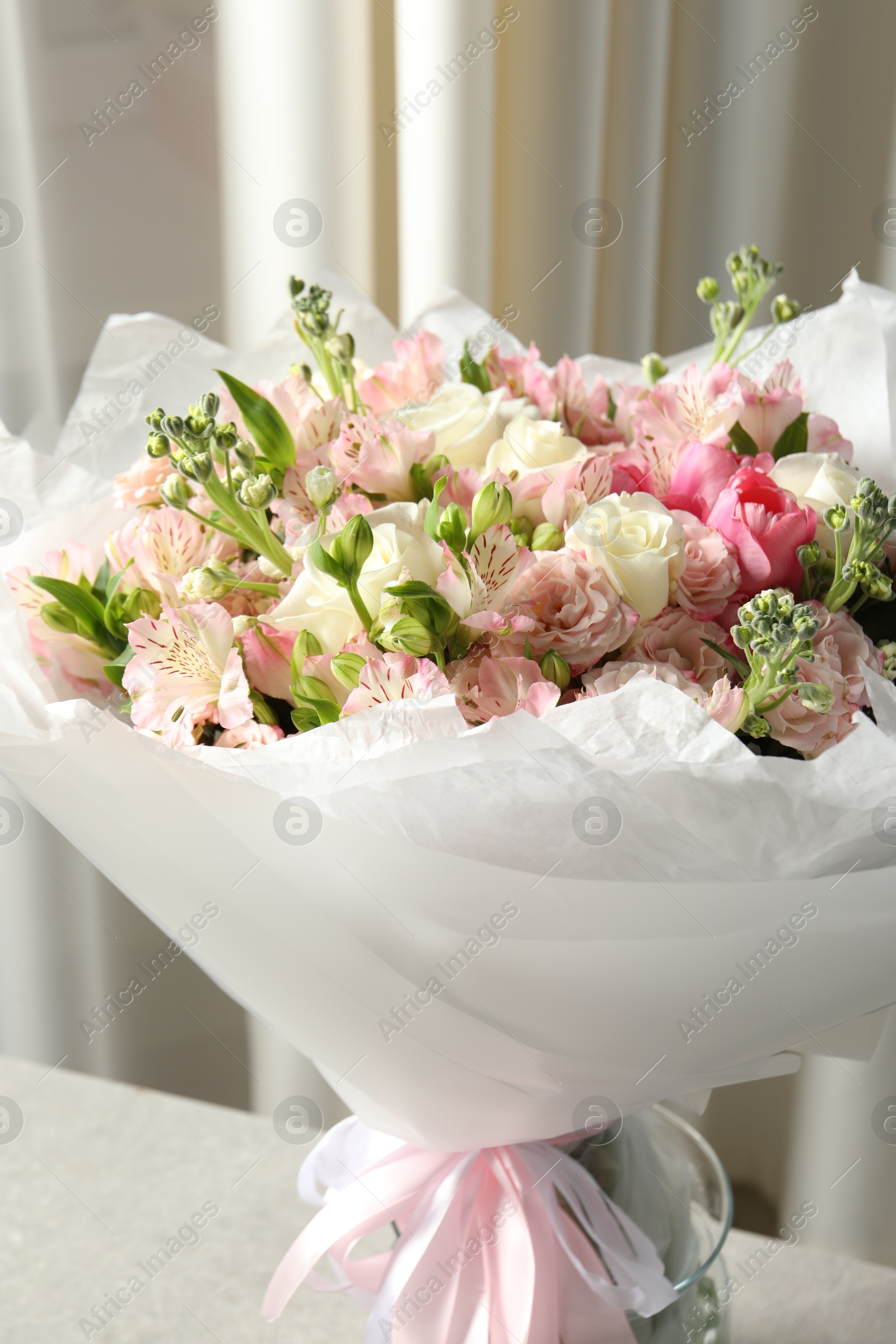 Photo of Beautiful bouquet of fresh flowers on table indoors, closeup