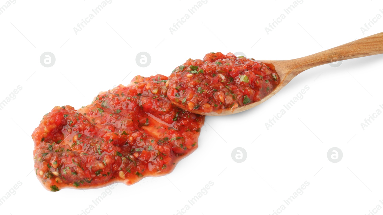 Photo of Tasty salsa sauce in spoon isolated on white