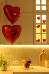 Photo of Romantic atmosphere. Cosy kitchen decorated for Valentine day