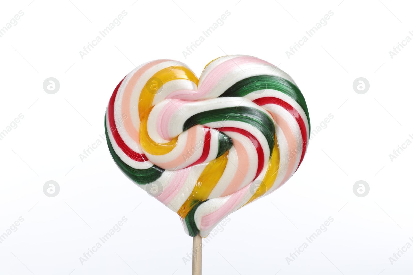 Photo of Heart shaped lollipop on stick against white background, closeup