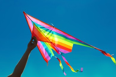 Photo of Man with kite on sunny day, closeup