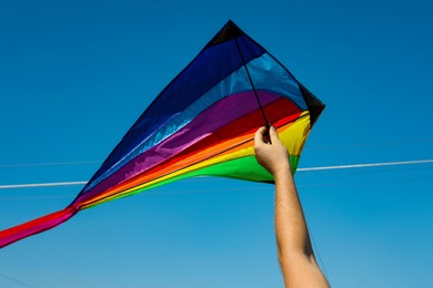 Photo of Man with kite on sunny day, closeup