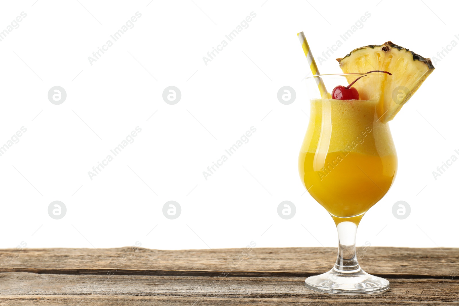 Photo of Tasty pineapple cocktail in glass on wooden table against white background