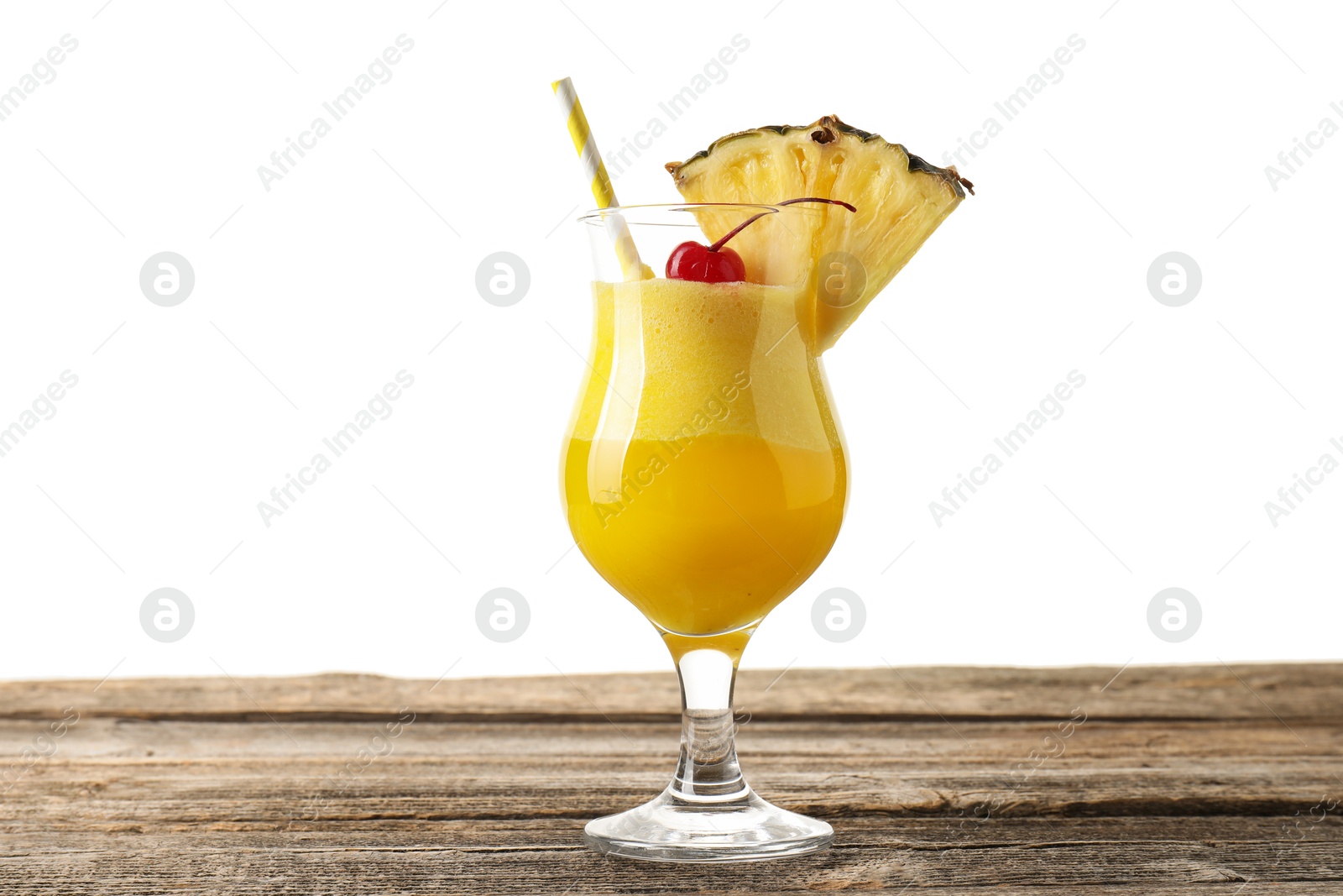 Photo of Tasty pineapple cocktail in glass on wooden table against white background