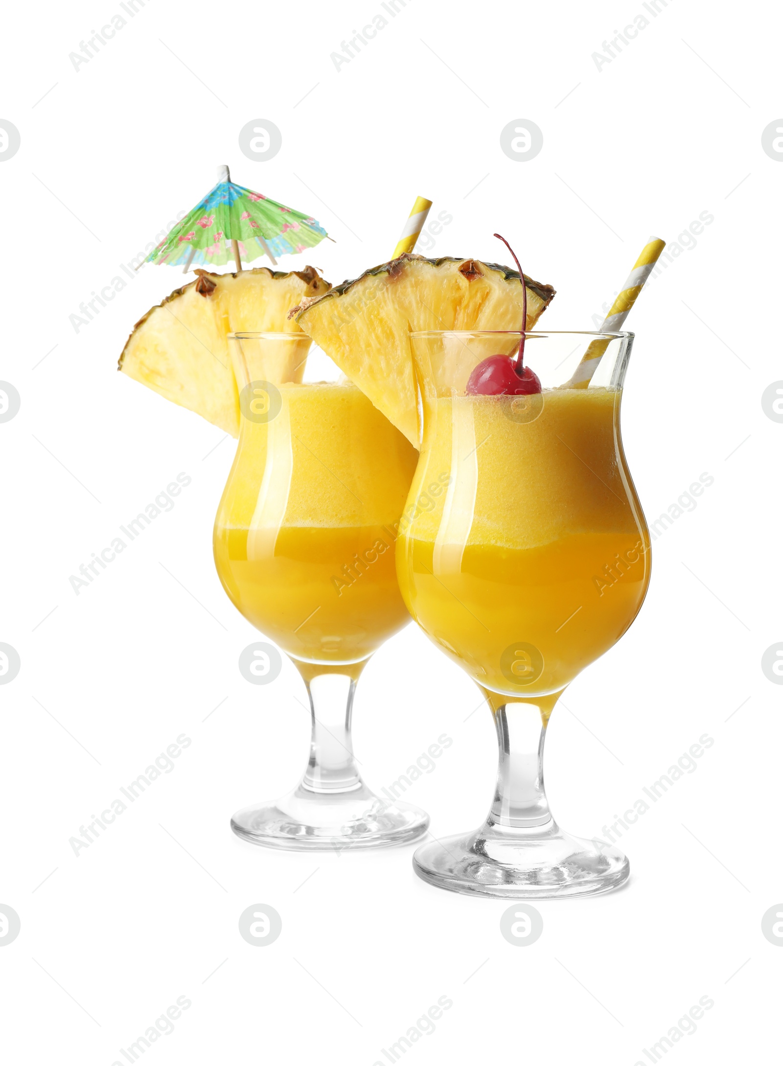 Photo of Tasty pineapple cocktail in glasses isolated on white