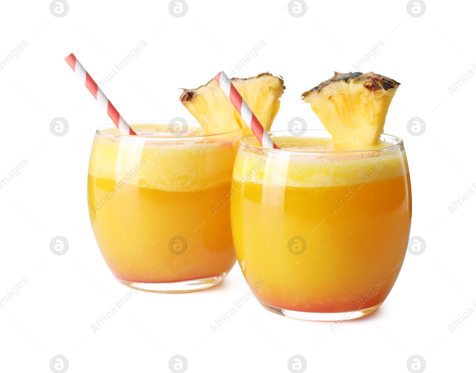 Photo of Tasty pineapple cocktail in glasses isolated on white