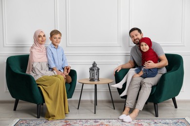 Photo of Happy Muslim family spending time together at home