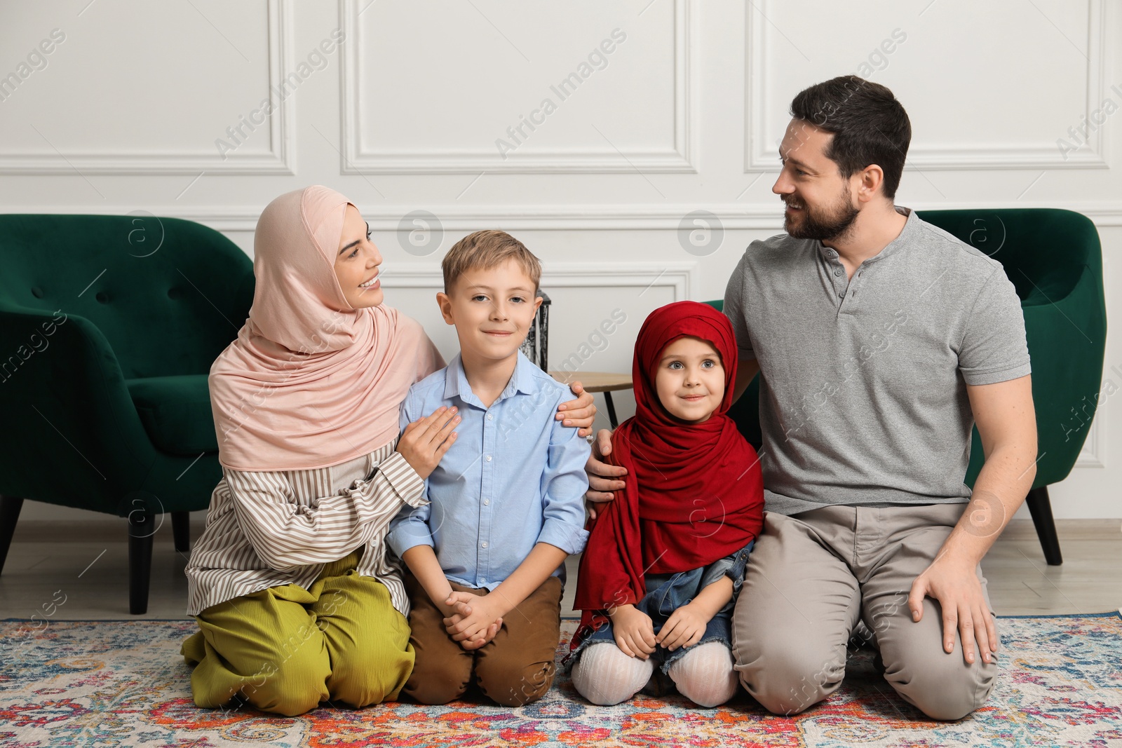 Photo of Happy Muslim family spending time together at home