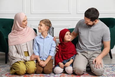 Photo of Happy Muslim family spending time together at home