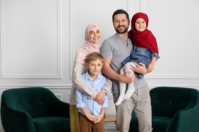 Photo of Happy Muslim family spending time together at home