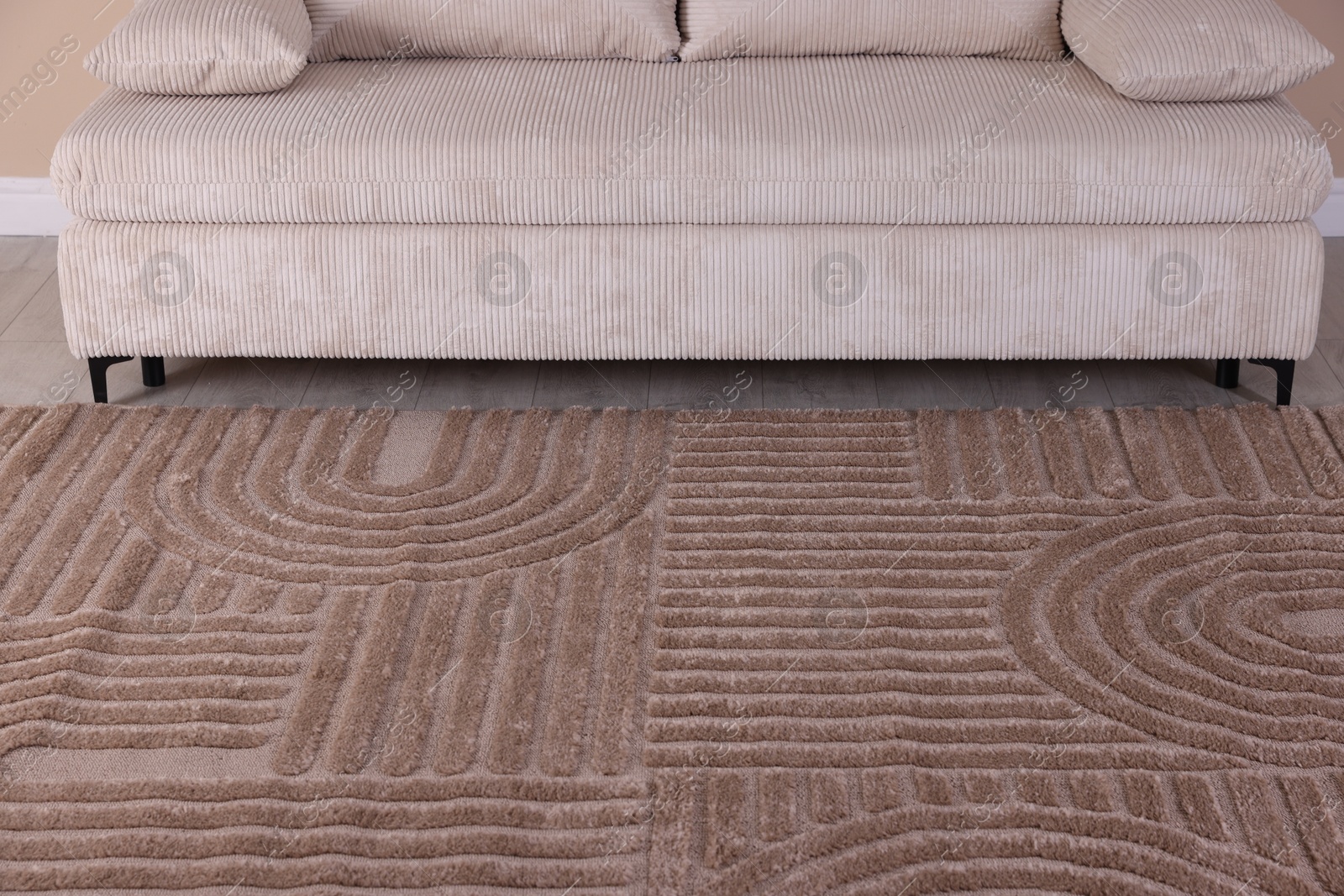 Stylish soft rug with pattern on floor indoors Photo of Stylish soft rug with pattern on floor indoors