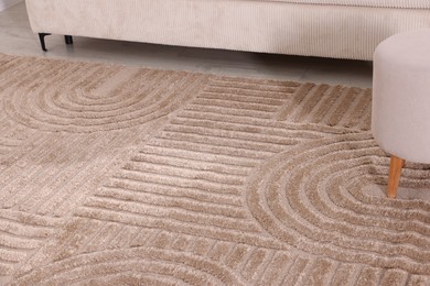 Photo of Stylish soft rug with pattern on floor indoors