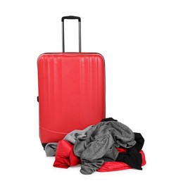 Photo of Suitcase and messy pile of clothes isolated on white