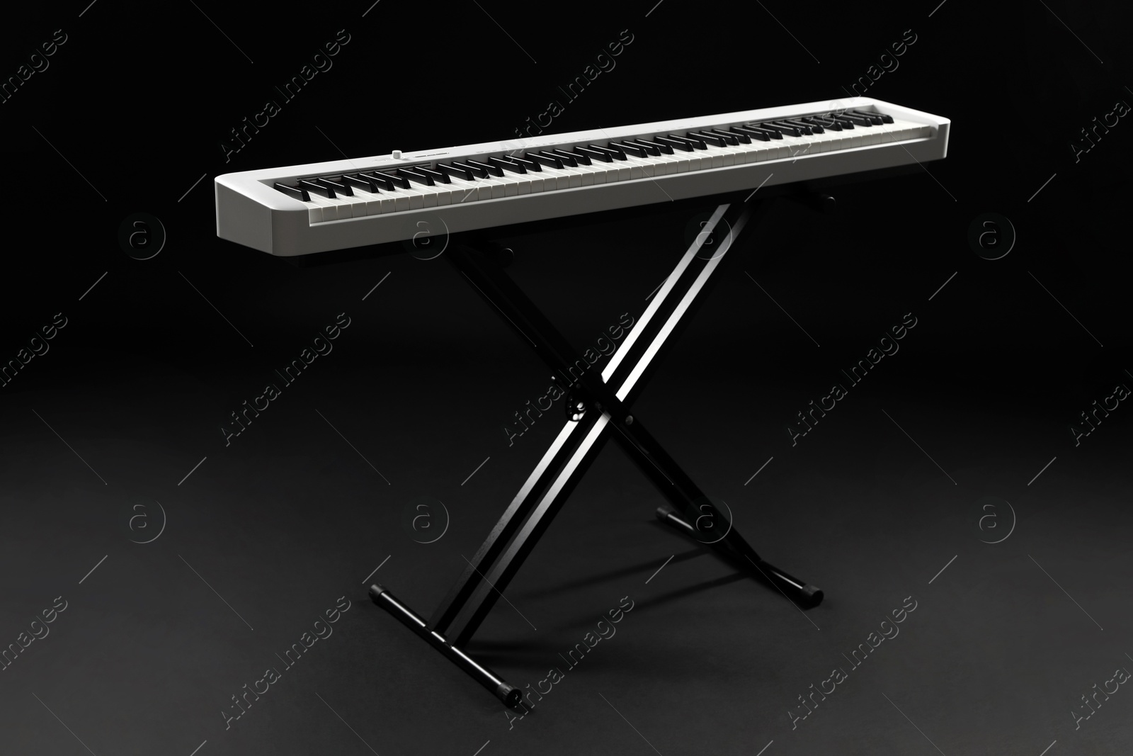 Photo of Synthesizer on black background. Electronic musical instrument