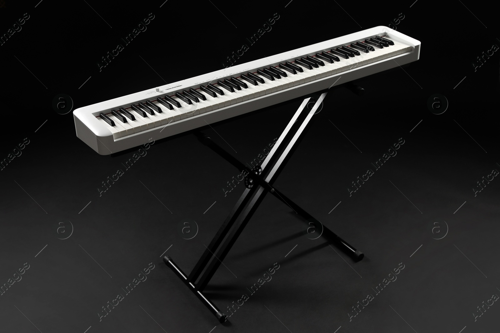 Photo of Synthesizer on black background. Electronic musical instrument