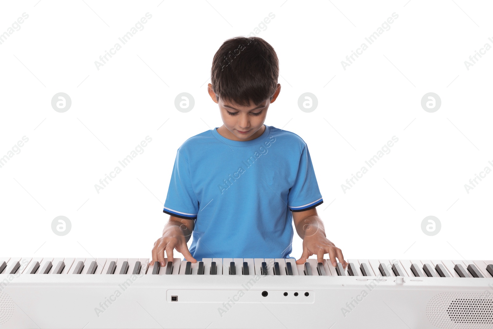 Photo of Cute boy playing synthesizer on white background