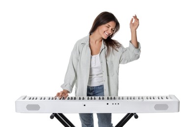 Photo of Smiling woman playing synthesizer on white background