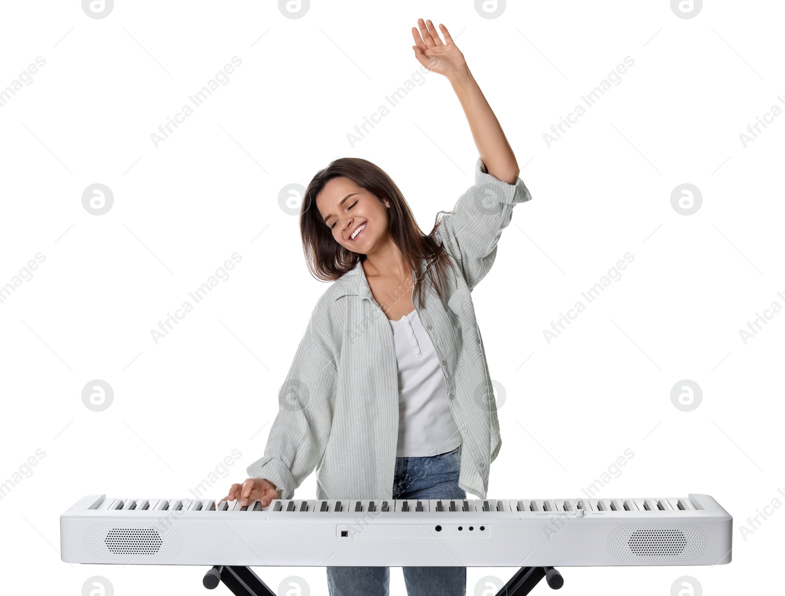 Photo of Smiling woman playing synthesizer on white background