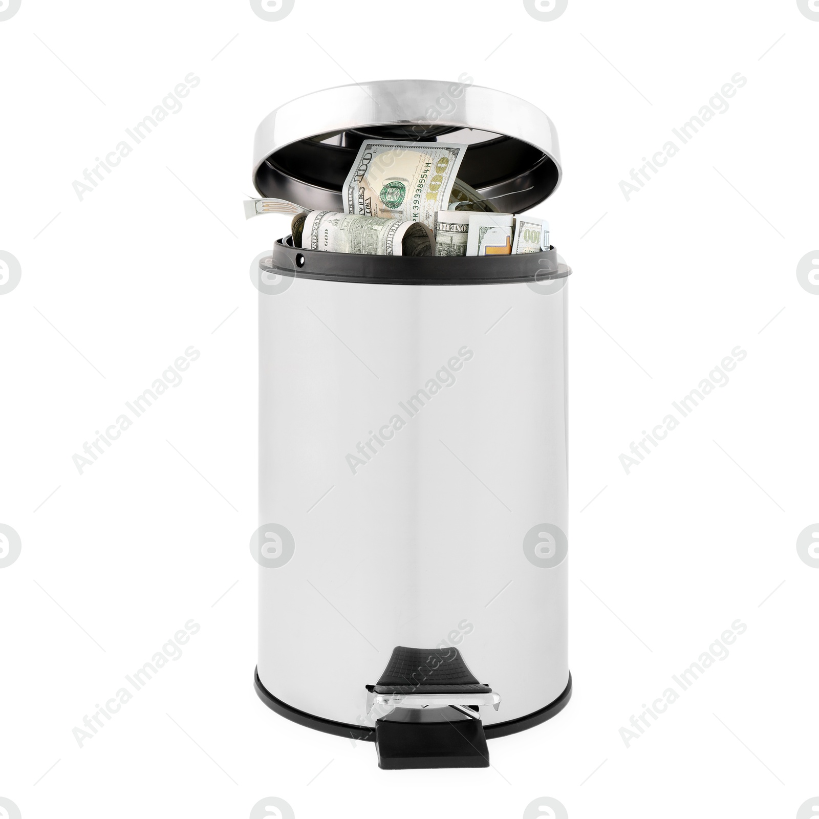 Photo of Dollar banknotes in trash bin on white background